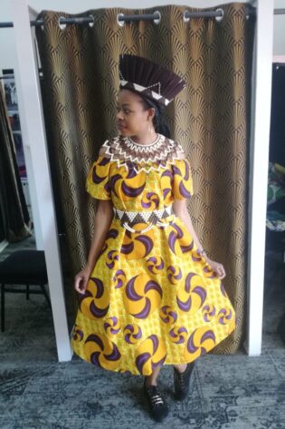 AFRICAN HERITAGE AFROPOLITAN YELLOW SHWE SHWE DRESS -LADIES AND ACCESSORIES - BROWN ZULU HEADPIECES ISICHOLO, ZULU BEADED NECKLACE, ZULU BEADED BELT